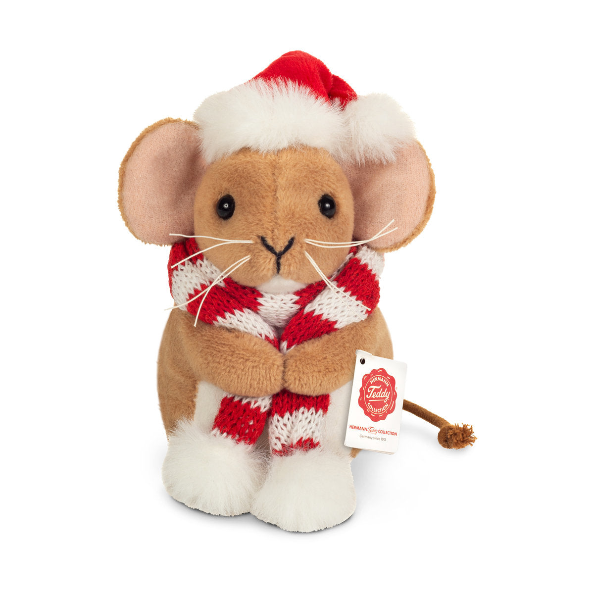 Tämä on Teddy-Hermannin jouluhiiri. Hän istuu, ja hänellä on lyhyt, tiheä beige turkki; masussa ja jalkaterissä on valkoista pörröä. Kuono on beige, viikset pitkät ja valkoiset, korvien sisäpuoli vaaleanpunainen. Silmät ovat mustat ja pyöreät, nenä musta ja V:n muotoinen. Häntä on ohut, ruskea ja solmupäinen. Päässä on punainen tonttulakki valkoisine pörröreunuksineen ja kaulassa punavalkoraitainen neulehuivi, jonka päissä on valkoiset tupsut. Ilme on lempeä ja tyytyväinen.