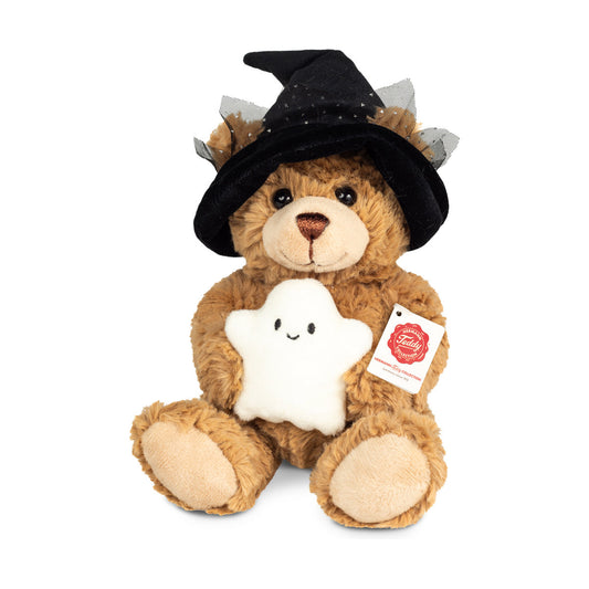 Det här är Halloween Teddy With Ghost, en nalle från Teddy-Hermann. Hen sitter och har halvlång, lätt lockig brun päls med svag glans, beige nos och beiga trampdynor; magen och öronens insida är bruna som resten. Ögonen är svarta och runda, nosen brun och triangelformad. Hen håller ett litet vitt spöke med broderade svarta ögon och leende mun. En svart häxhatt med rynkad svart tyll nedtill sitter över öronen. Pälsen ser tät och mjuk ut och minen verkar vänlig och nöjd.