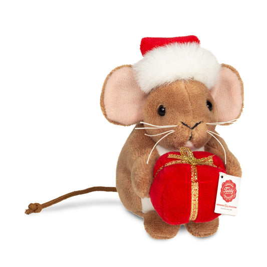 Det här är en liten julmus från Teddy-Hermann. Den sitter upprätt och håller i en röd present med guldband. Pälsen är brun, kort och slät med svag glans, magen är vit och öronens insida rosa. Ögonen är svarta och runda, nosen liten, svart och triangelformad, morrhåren vita och långa. Öronen är stora och rundade, tassarna bruna och en lång, tunn svans sticker ut bakom. Den har en röd tomteluva med vit, fluffig kant och pompom, och uttrycket verkar milt och glatt.