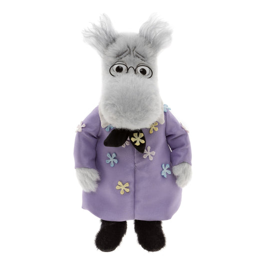 This is Minimo Hemulen by Charlie Bears. Minimo Hemulen has soft light gray alpaca wool fur that is medium-long, slightly shaggy with wispy tufts on the ears and a low sheen; the legs and feet fur are solid black and appear denser and shorter. The muzzle, hands and visible paw areas are light gray matching the head; inner ears are slightly darker gray. Eyes are black centres with white surrounds and framed by small round black glasses; there is no distinct external nose visible. Dark stitched brow line...