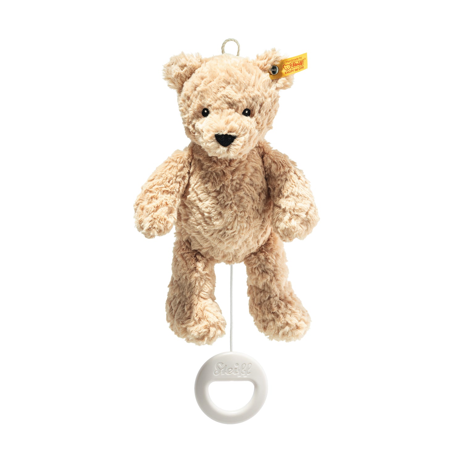 This is Jimmy by Steiff. This small bear has a soft, medium-length, slightly curly plush coat with a low sheen; the coat colour is beige overall with no contrasting patches. The muzzle, inner ears, tummy and paw faces are all the same beige as the rest of the body. The bear has small black plastic eyes and a black stitched nose. No additional markings or coloured fur accents are visible. It is shown hanging upright from a fabric loop with limbs relaxed downward and a white pull cord and white plastic p...