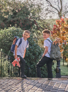 Boys on the way to school with Folly Fox and Charlie Bear