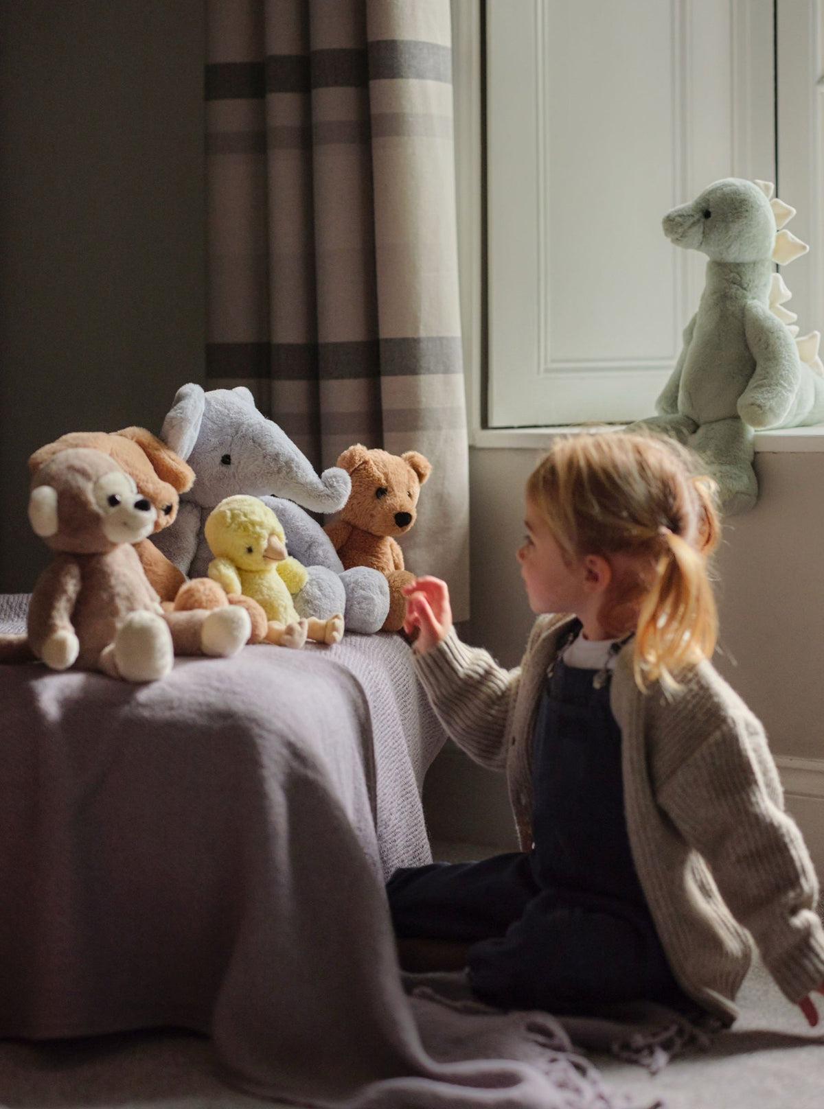 Child playing with Bear & Me friends