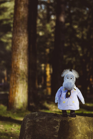 The Hemulen standing on a mossy rock