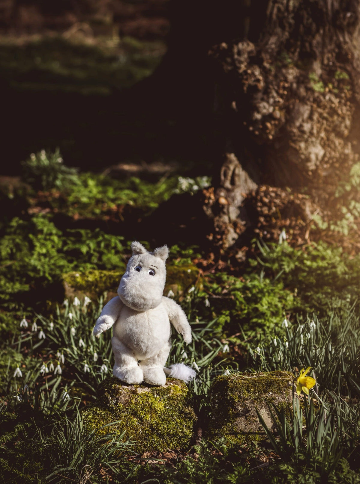 Moomintroll in a mossy forest