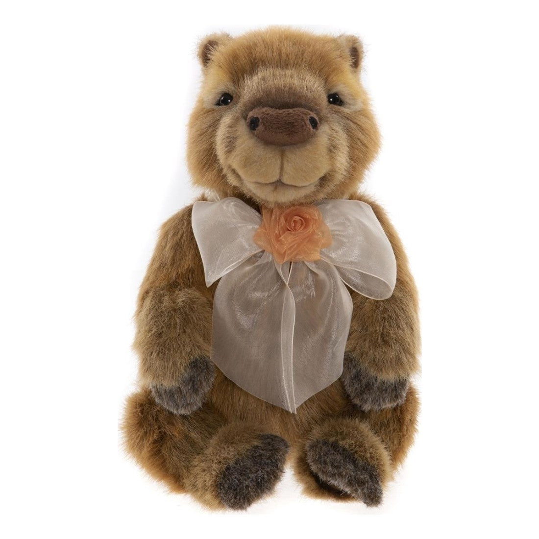 This is Peru by Charlie Bears. Sitting capybara with medium-length, slightly shaggy fur that has a soft sheen; fur colours are brown and beige with darker gray accents. The muzzle is medium brown and rounded, with small black nostril embroidery; the eye colour is black set into slightly lighter beige eye rims. Inner ears are brown similar to the main fur. The tummy is beige and visibly shorter-haired than the body fur. The paws and paw pads show darker gray tips and shading. There are subtle darker mar...